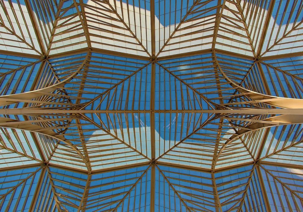 gold metal glass roof structure blue white